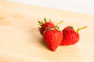Fresh strawberry on wood.