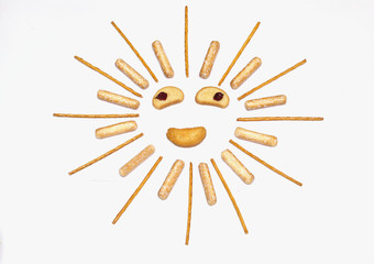 Cheerful sun of bread sticks on white background