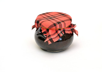 jar of jam tied with a checkered headscarf