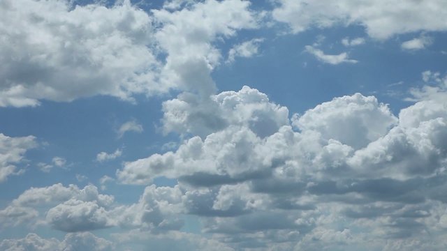 timelapse clouds in summer in blue sky with sun