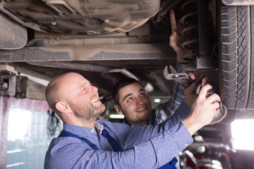Fototapeta na wymiar Two man fixing car