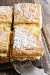 A Polish cream pie made of two layers of puff pastry, filled wit