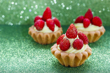 Beautiful tiny cupcakes with wild strawberries