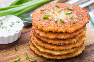 Potato pancakes on a wooden board