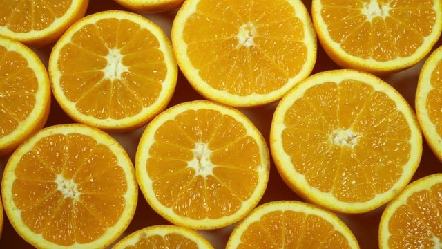 sliced oranges turning and zoomed