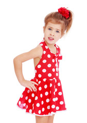 fashionable girl in red dress with polka dots.