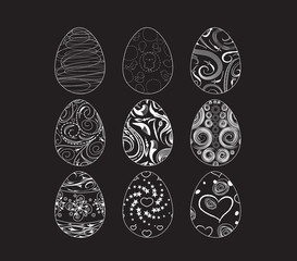 A set of black-and-white easter eggs decorated with ornament