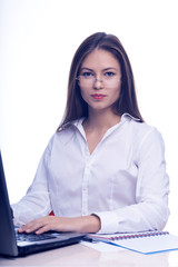 Businesswoman working with laptop at the office