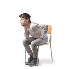 Boy sitting on a chair