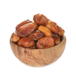 dried dates in a wooden bowl