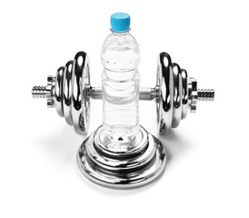 Water bottle and a dumbbell, fitness concept