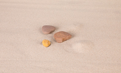 Fototapeta na wymiar Rocks on the sand.