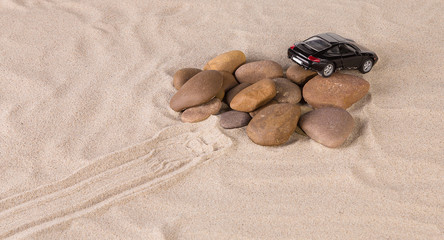 Fototapeta na wymiar Concept of black racing car on the sand.