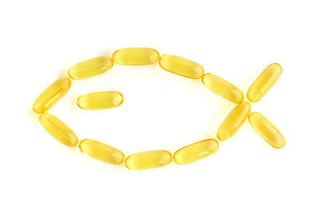 Omega-3 capsules on white background, fish shape