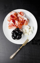 Antipasti ham, cheese, olive oil , rosemary, feta cheese