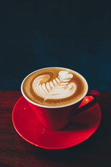 cup of coffee on the wooden desk