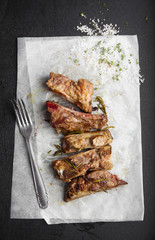 bloody fried pork ribs with herbs, salt and spices