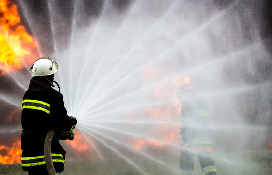 Firefighters extinguish the fire during training