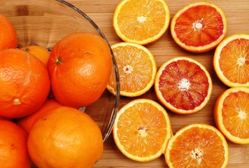 Fresh organic oranges on a wooden board
