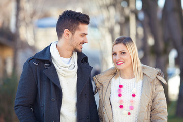 Fototapeta premium Portrait of happy young couple on the street