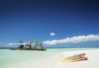 white beach and christian shrine and paddle boats on boracay tro