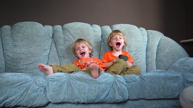 Kids twins on the couch