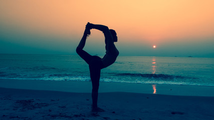  young woman practicing yoga