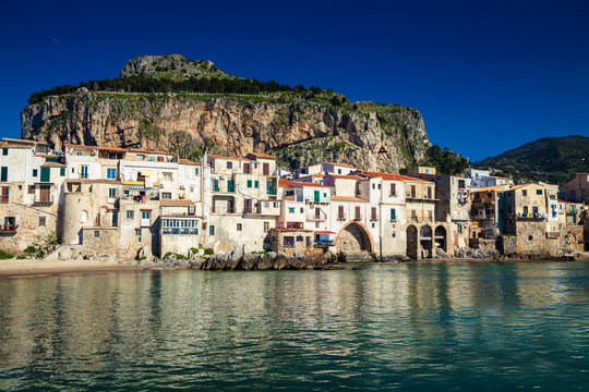 old houses and the mountain on a background in Cefalu