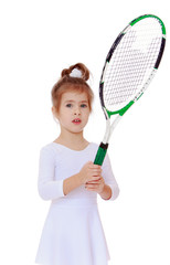 three-year girl with a tennis racket in hand.