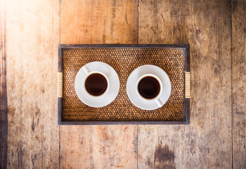 Two Cup of coffee on a wooden table