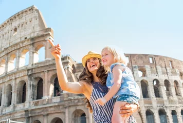 Printed kitchen splashbacks Rome Happy mother and baby girl sightseeing near colosseum in rome