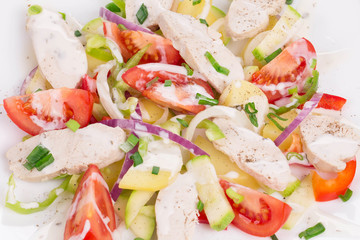 Warm meat salad with vegetables