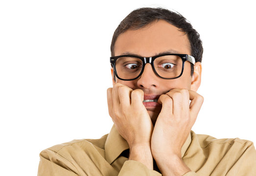 headshot stressed anxious young man biting his fingernails 