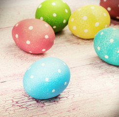 Fototapeta na wymiar colored Easter eggs on wooden background
