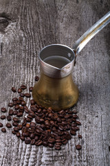 Coffee turk and coffee beans on old gray wooden table