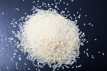 Handful rice on a black background