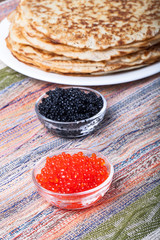 Russian pancakes - blini with red and black caviar