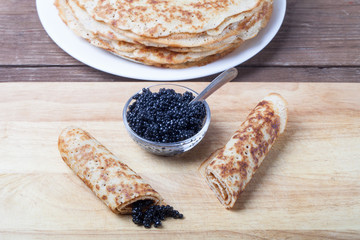 Russian pancakes - blini with black caviar