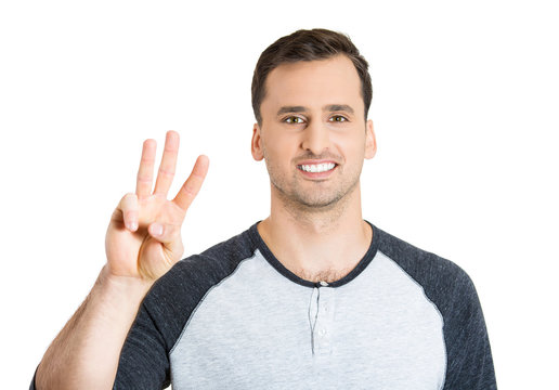 man giving a three fingers sign gesture with hand