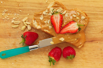 Peanut butter sandwich on a wood background