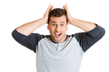 Smiling young man with surprised expression