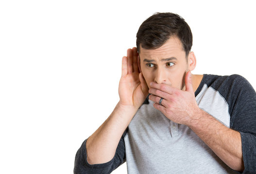 man with hand behind ear listening closely carefully 