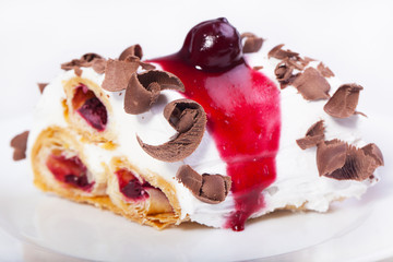 Cake with cherries and chocolate.