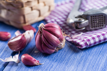 Fresh whole garlic,garlic cloves and press on table