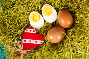 Organic eggs on blue wood background