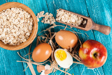 Organic eggs on blue wood background