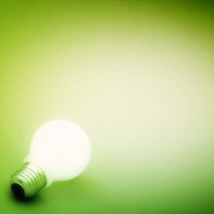 Background with lit lightbulb