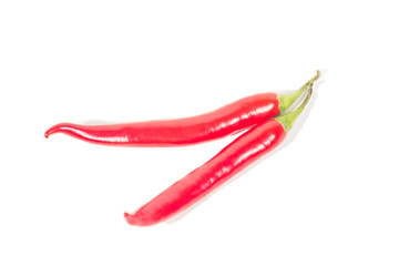 couple peppers chli lie on a white background