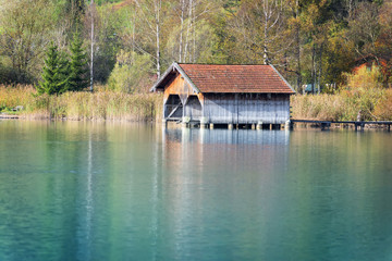 Fototapeta na wymiar boathouses at lake Kochelsee