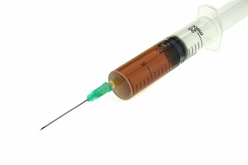 Fototapeta premium Medical Syringe With Brown Liquid Solution